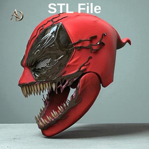 May include: A red helmet with a wide-open mouth featuring sharp, pointed teeth and black, vein-like patterns extending from the dark, glossy eye areas. The text STL File is visible at the top, and a gold AD logo is in the upper left corner.