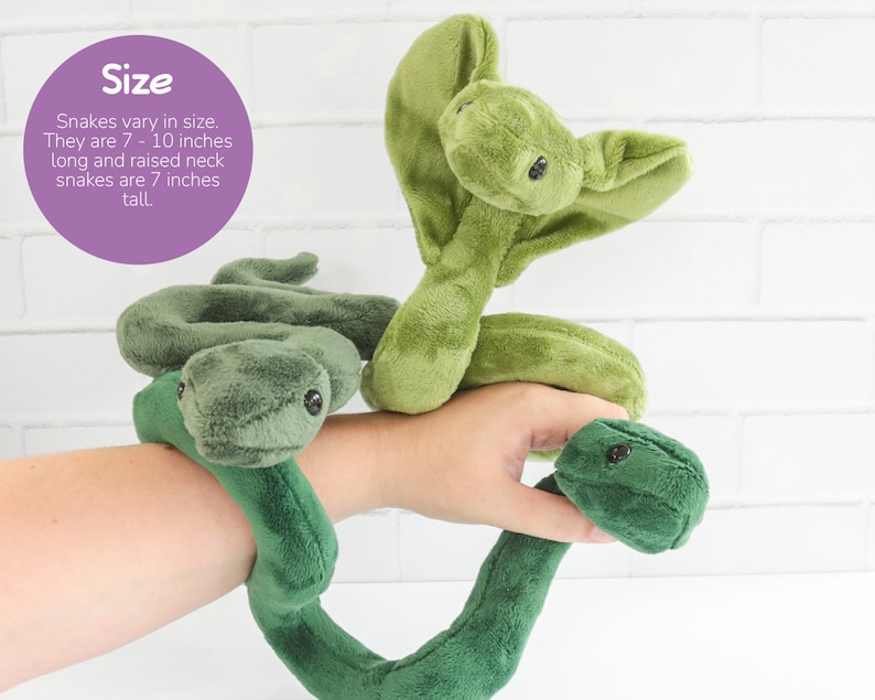 May include: Two green plush snake toys. The snake on the left is curled into a circle, while the snake on the right has its head raised up. The text "Size" is written in purple on a white background. The text reads: "Snakes vary in size. They are 7 - 10 inches long and raised neck snakes are 7 inches tall."