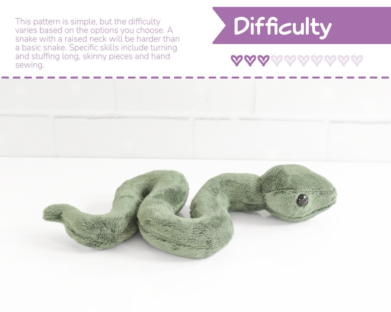 May include: A green plush snake toy with a raised neck. The difficulty level is indicated by a row of hearts, with some filled in and some empty. The text "Difficulty" is above the hearts.