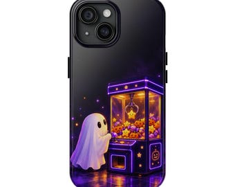 May include: A black smartphone case featuring a graphic of a white ghost standing before a glowing purple claw machine filled with orange jack-o'-lanterns, yellow stars, and purple candies against a dark, starry background.