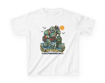 May include: A white t-shirt featuring a graphic illustration of a green robotic figure kneeling in shallow water, surrounded by kelp, seagulls, and an orange sun. The text KELPWARDEN-04 is printed in dark blue below the illustration.