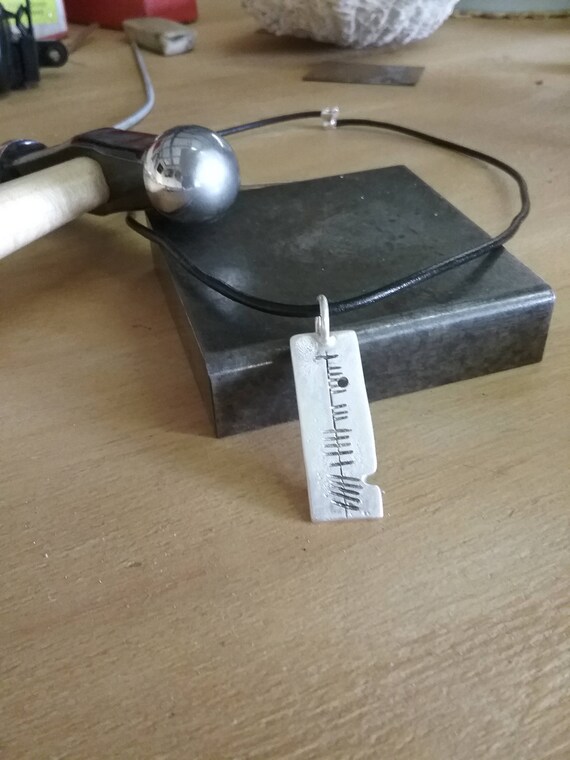 Contemporary Celtic Silver pendant with Ogham Inscription for a fashionable modern Man.