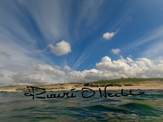 Sea, Hill and Blue Skies