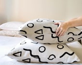 Continental Shapes Pattern 23.6 x 23.6 inch Pillow Cover in White or Stone