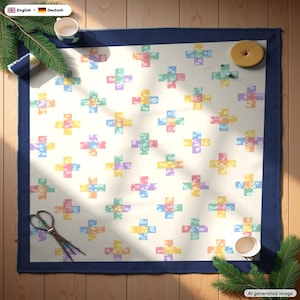 May include: A square fabric quilt featuring a repeating pattern of pastel-colored plus signs on a cream background. Each plus sign is composed of smaller floral-printed squares in shades of yellow, pink, blue, green, and purple.
