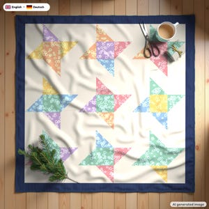 May include: A square quilt featuring a grid of nine star-shaped patterns in pastel floral prints of yellow, pink, blue, and green on a cream background, framed by a dark blue border, with a pair of scissors, a mug, and a small gift nearby.