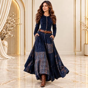 May include: A long-sleeved navy blue dress featuring a button-down bodice, a brown leather belt with a gold buckle, and a full-length skirt with integrated pockets and a dark blue and brown plaid pattern on the lower panels and side sections.