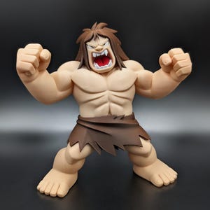 May include: A muscular, light-skinned figurine with brown hair, wearing a dark brown tattered loincloth. The figure has a wide, open-mouthed expression showing white teeth and a red interior, with both arms raised in a clenched fist pose.