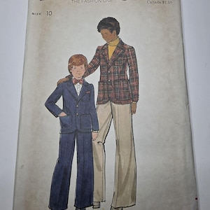 May include: Butterick sewing pattern 4088, size 10, featuring illustrations of two outfits: a dark blue suit with a bowtie and a plaid blazer with a yellow turtleneck and light-colored trousers. The envelope includes the brand name and pattern number.