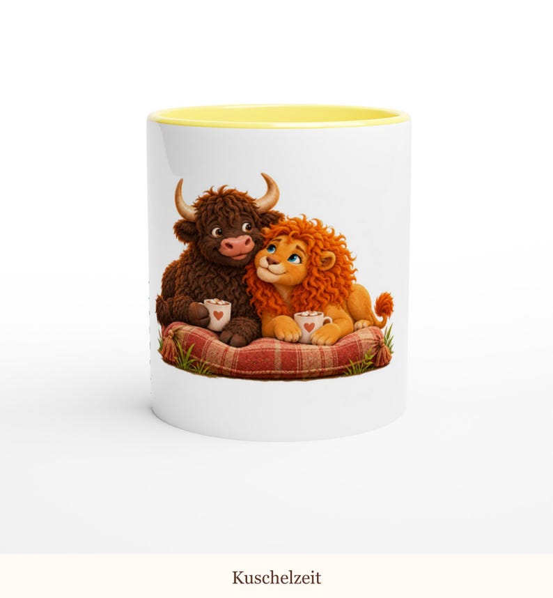 May include: A white ceramic mug with a yellow rim featuring a graphic of a brown Highland cow and an orange lion sitting on a red plaid cushion, each holding a small white mug with a red heart design, set against a plain white background.