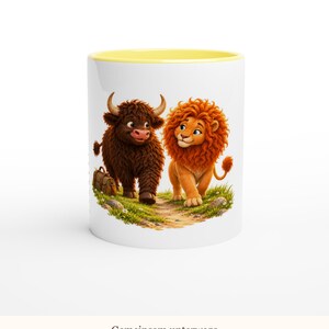May include: A white ceramic mug with a yellow interior rim featuring a cartoon illustration of a brown highland cow and an orange lion walking together on a grassy path. The text "Gemeinsam unterwegs" is printed at the bottom of the mug.