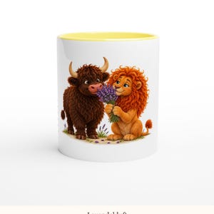 May include: A white ceramic mug with a yellow interior rim featuring a cartoon illustration of a brown Highland cow and an orange lion holding a bouquet of purple lavender flowers. The text Lavendelduft is printed at the bottom.