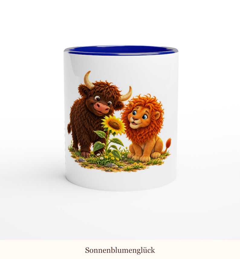 May include: A white ceramic mug with a dark blue interior and rim. The exterior features a colorful illustration of a brown Highland cow and an orange lion sitting together in a grassy field, looking at a single yellow sunflower.