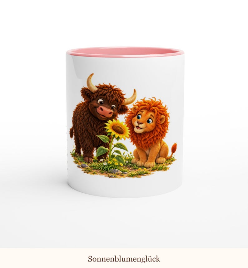 May include: A white ceramic mug with a pink interior and rim, featuring a colorful illustration of a brown highland cow and an orange lion sitting together in a grassy field next to a bright yellow sunflower with the text Sonnenblumengl&uuml;ck.