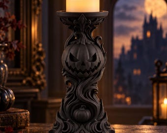May include: A black candle holder featuring a sculpted jack-o'-lantern face and swirling decorative patterns. The base is wide and ornate, supporting a top platform that holds a single, lit, off-white pillar candle with a warm glow.