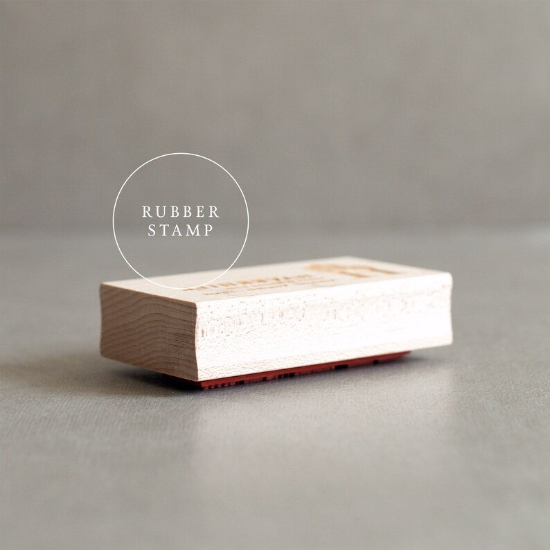 May include: A wooden rubber stamp with the text "RUBBER STAMP" in a circle above the stamp.