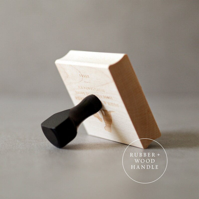 May include: A wooden stamp with a black handle. The stamp has a design of a bird with the text "24/122" and "Love you more than words can say" on it. The stamp is labeled "Rubber + Wood Handle".
