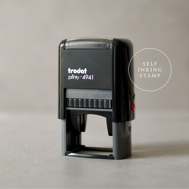 May include: A black self-inking stamp with the text "trodat printy - 4941" on the front. The stamp is labeled "SELF INKING STAMP".