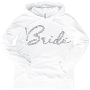 May include: White hoodie with a rhinestone design that says "Bride" on the front.
