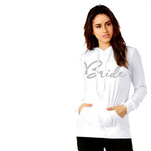 May include: White hoodie with a silver glitter 'Bride' graphic on the front.