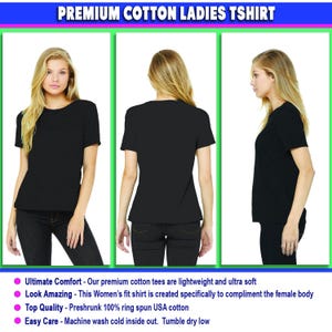 May include: A plain black short-sleeved t-shirt shown from the front, back, and side views. The garment features a crew neckline and a solid color design. The text at the top reads PREMIUM COTTON LADIES TSHIRT, with additional text below.
