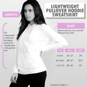 May include: A size chart for a lightweight pullover hoodie sweatshirt. The chart shows sizes S, M, and L with corresponding bust and length measurements in inches. The model is wearing a size S.