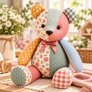 Handmade patchwork memory teddy bear sewing pattern inspiration featuring a colorful floral, gingham, striped and polka dot fabric teddy bear with a coral ribbon bow, displayed on a wooden table with cozy cottage-style decor, perfect for a DIY keepsake bear project.