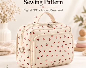 May include: A cream-colored rectangular pouch with a red cherry print, a top handle, and a zippered front pocket. The text reads: Diaper & Wipe Pouch Sewing Pattern, Digital PDF, Instant Download, Finished Size: 25 cm x 17.5 cm x 10 cm.