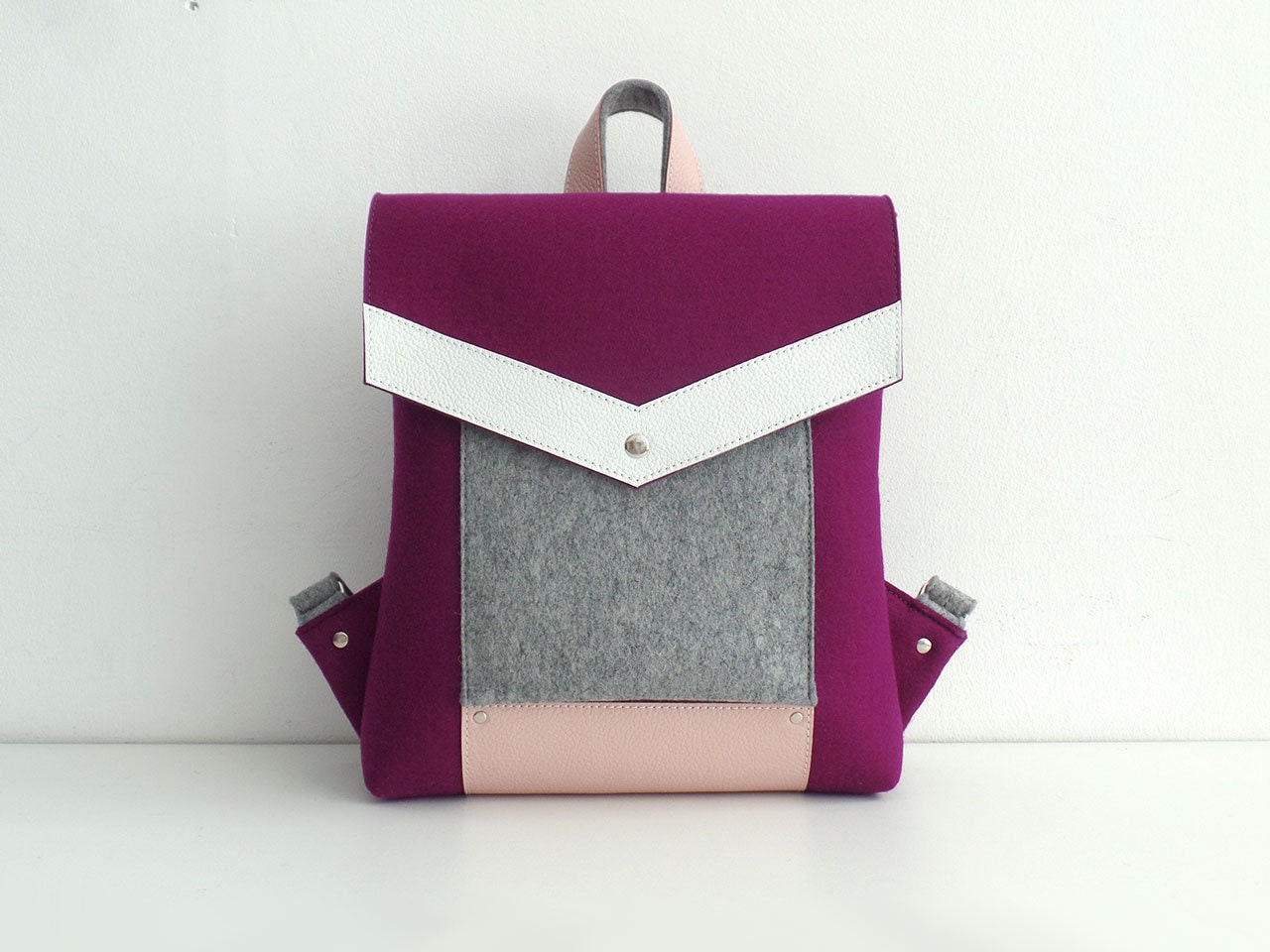 purple and white backpack