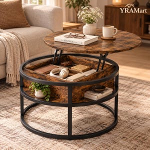 May include: A round coffee table with a dark wood grain finish and a black metal frame. The top lifts to reveal a hidden storage compartment containing headphones and small items. A lower shelf holds a small potted plant and stacked books.