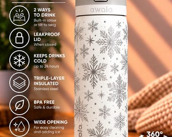 May include: A white Owala FreeSip stainless steel water bottle featuring a silver snowflake pattern. The bottle has a gray lid with a lift-to-unlock mechanism, a built-in straw, and a leakproof design. Text on the bottle includes Owala FreeSip.