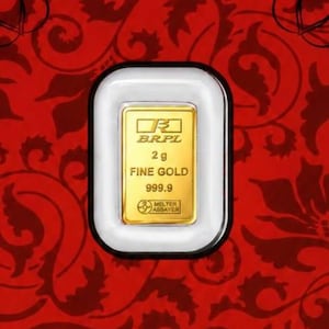 May include: A rectangular 2g fine gold bar with 999.9 purity, encased in a clear protective plastic holder with a black border. The gold bar features the BRPL logo, the text 2 g, FINE GOLD, 999.9, and a circular Melter Assayer stamp on its surface.