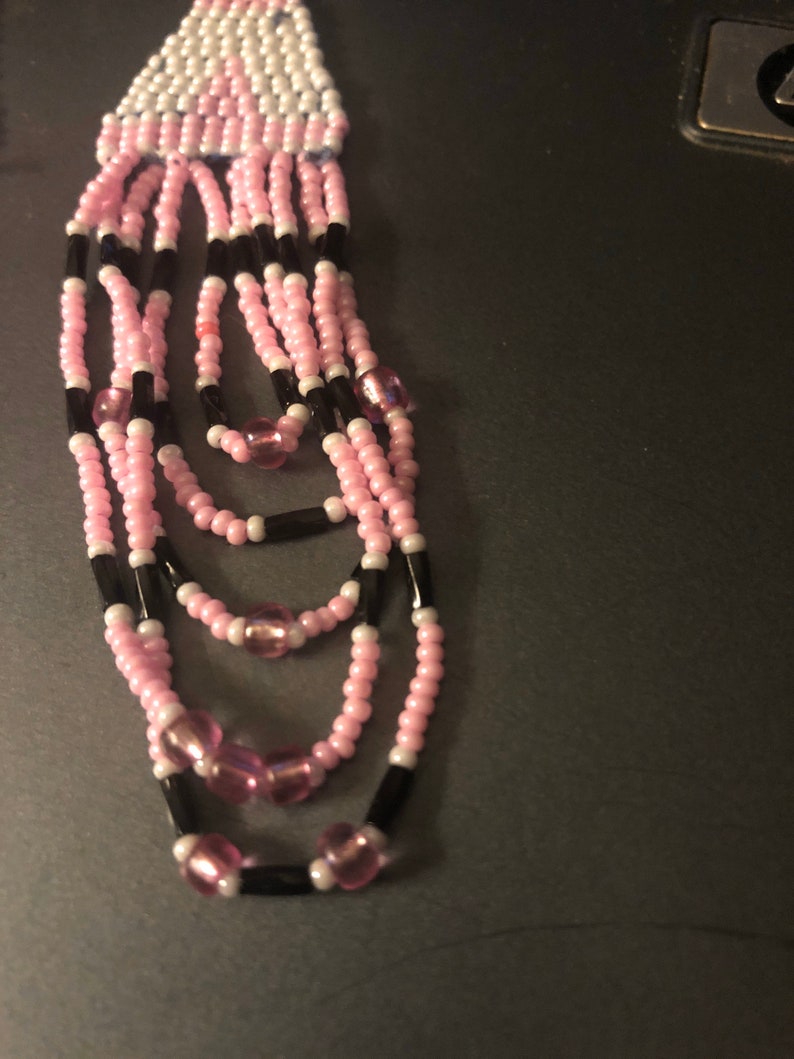 pink white and black hand beaded fringed earrings