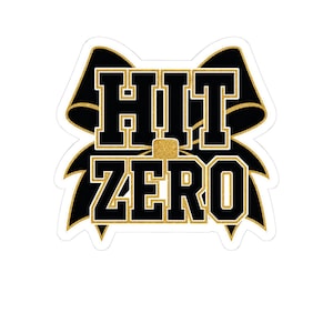 May include: A die-cut sticker featuring a black and gold glitter cheer bow graphic. The text HIT ZERO is printed in bold, black block letters with a gold glitter outline, centered over the bow design against a white background.