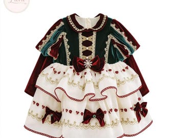May include: A long-sleeved dress featuring a dark green velvet bodice with a cream-colored lace-up front, a round collar, and a multi-layered white skirt with red floral embroidery, gold trim, and three dark red velvet bows.
