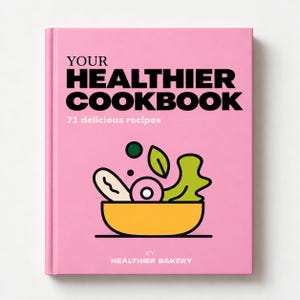 Può includere: Un libro di cucina con copertina rigida rosa intitolato YOUR HEALTHIER COOKBOOK con il sottotitolo 71 delicious recipes. La copertina presenta un'illustrazione grafica di una ciotola gialla piena di verdure stilizzate e il testo BY HEALTHIER BAKERY.