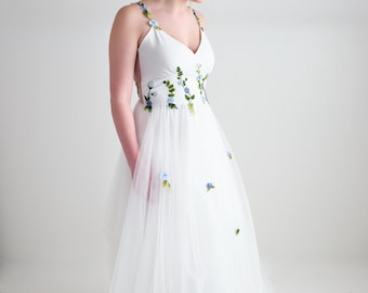 whimsical floral wedding dress with romantic draped soft tulle skirt, customizable colors, design and removable flutter sleeves