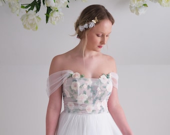 Ethereal wedding dress with delicate floral embroidery in soft romantic colours with removable tulle sleeves and soft a-line tulle skirt