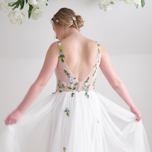 floral wedding dress with whimsical romantic draped soft tulle skirt and customizable colors and design removable flutter sleeves