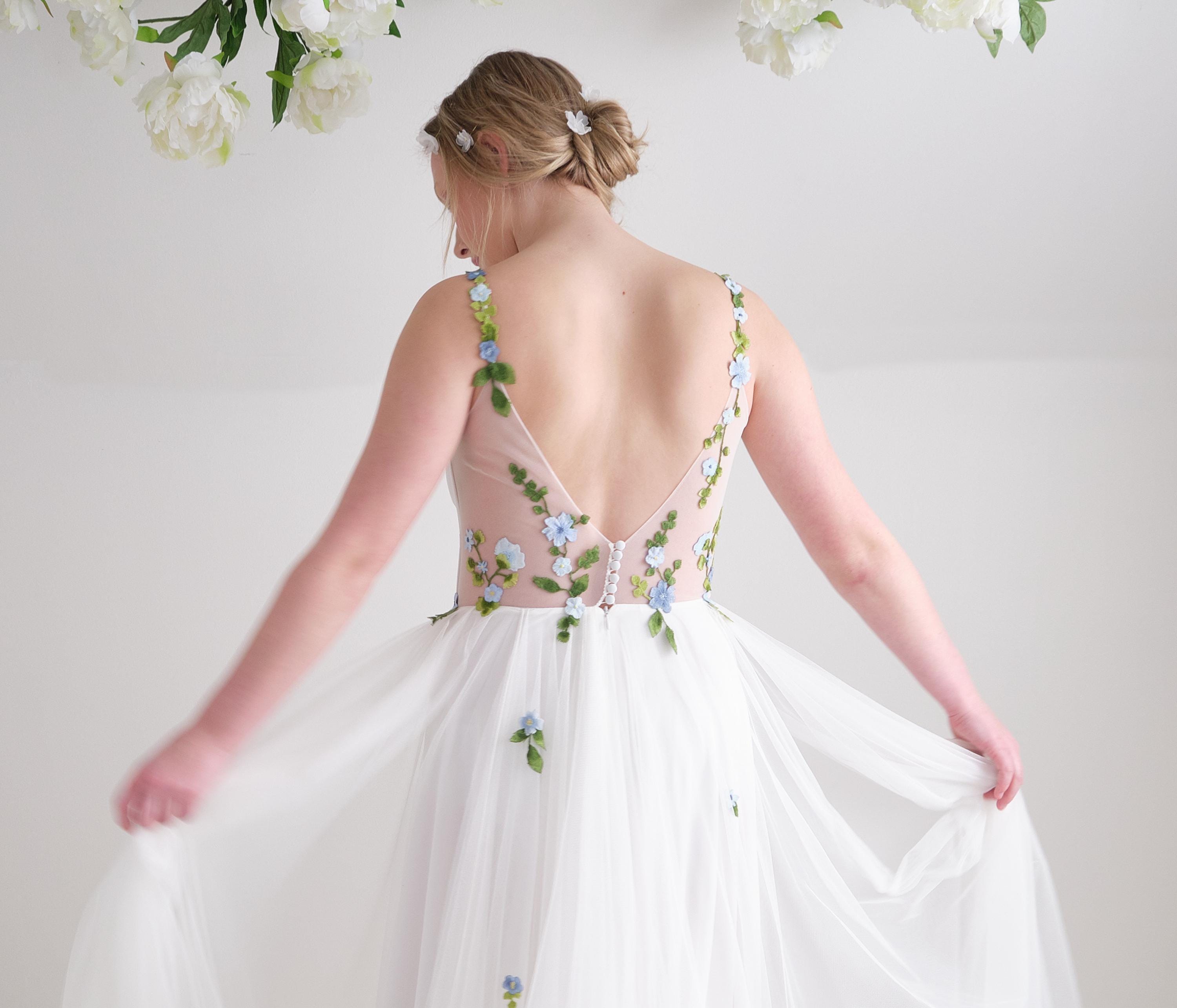 floral wedding dress with whimsical romantic draped soft tulle skirt and customizable colors and design removable flutter sleeves