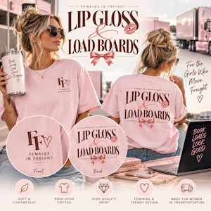 May include: A light pink t-shirt featuring the text "Females in Freight" and "Lip Gloss & Load Boards" in dark brown lettering. The design includes a small heart, a lip print, and a bow graphic. The front displays a logo, while the back shows the full text.