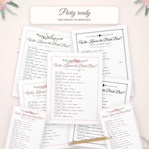 May include: A collection of printed game sheets titled Who Knows the Bride Best, featuring floral accents in pink and green. The white paper sheets include multiple-choice questions and host answer keys, with a wooden pencil placed on top.