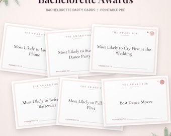 May include: A set of white Bachelorette Awards party cards with light pink borders and dark text. The cards feature titles like Most Likely to Cry First at the Wedding, Best Dance Moves, and Most Likely to Lose Phone, with lines for names.