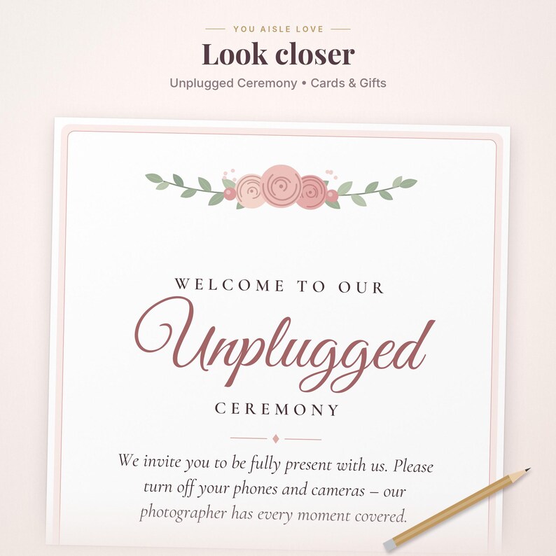 May include: A rectangular wedding sign with a white background and a light pink border. The text reads: Welcome to our Unplugged Ceremony. We invite you to be fully present with us. Please turn off your phones and cameras. A floral illustration sits above the text.