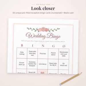 May include: A white wedding bingo card featuring a floral illustration of pink roses and green leaves at the top. The text reads Wedding Bingo, Mark each square when it happens during the reception. Five in a row? Shout BINGO! A wooden pencil lies nearby.