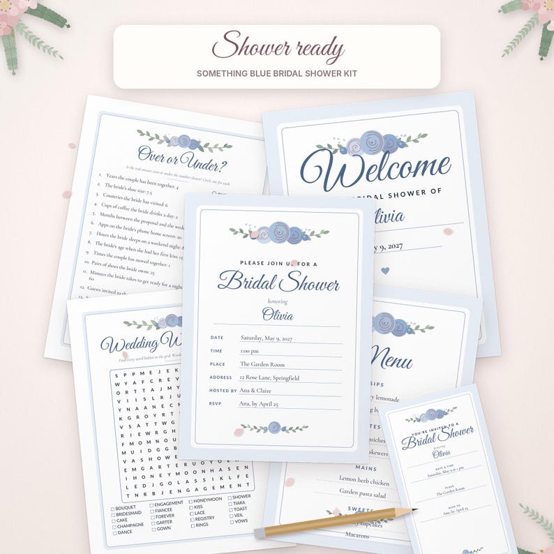 May include: A bridal shower stationery kit featuring blue floral accents and dark blue text. The set includes a welcome sign, invitation, menu, wedding word search, and an Over or Under game, all displayed on a light pink background with a wooden pencil.