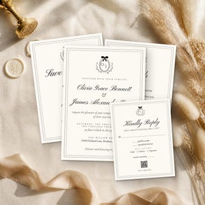 May include: A set of cream-colored wedding invitation cards with black text and a scalloped border. The main invitation features the names Olivia Grace Bennett and James Alexander, a monogram with a bow, and details for a ceremony at The Willow Barn.