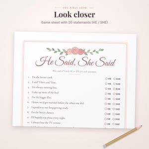 May include: A white game sheet titled He Said, She Said with a floral illustration of pink roses and green leaves. The sheet contains ten numbered statements with HE and SHE circles for selection, plus a wooden pencil at the bottom right.