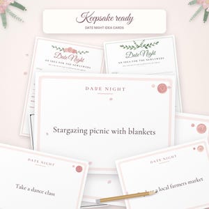 May include: A collection of white date night idea cards with pink borders and floral accents. The cards feature text including "Keepsake ready," "Date Night," "An idea for the newlyweds," and specific activities like "Stargazing picnic with blankets."