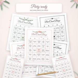 May include: A set of thirty Bar Crawl Bingo cards for a bride, featuring a grid with the letters B R I D E at the top, floral accents, and a central square labeled Cheers. A wooden pencil is placed across the bottom of the cards.